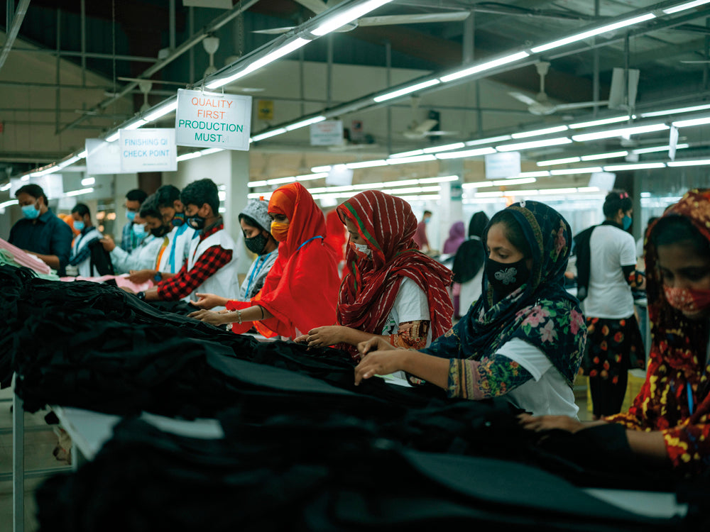 Image showing textile workers in a safe, fair labour certified environment, underscoring teeone's commitment to ethical sourcing and production.