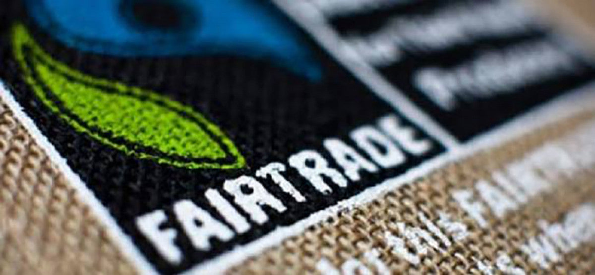 Close-up of a printed FairTrade logo on a tote bag, demonstrating teeone's dedication to supporting FairTrade practices.