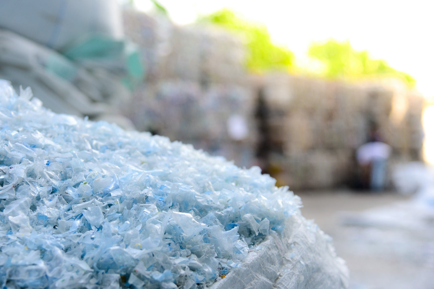 Close-up image of recycled polyester chips, representing teeone's commitment to sustainable fabric production.
