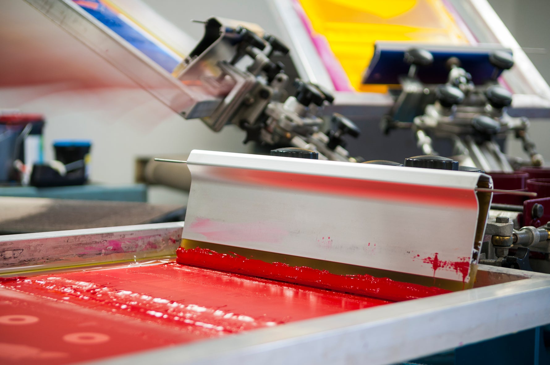 Artistry in Action: Close-Up of Screen Printing Process on a T-Shirt, Crafting Vibrant Designs with Precision